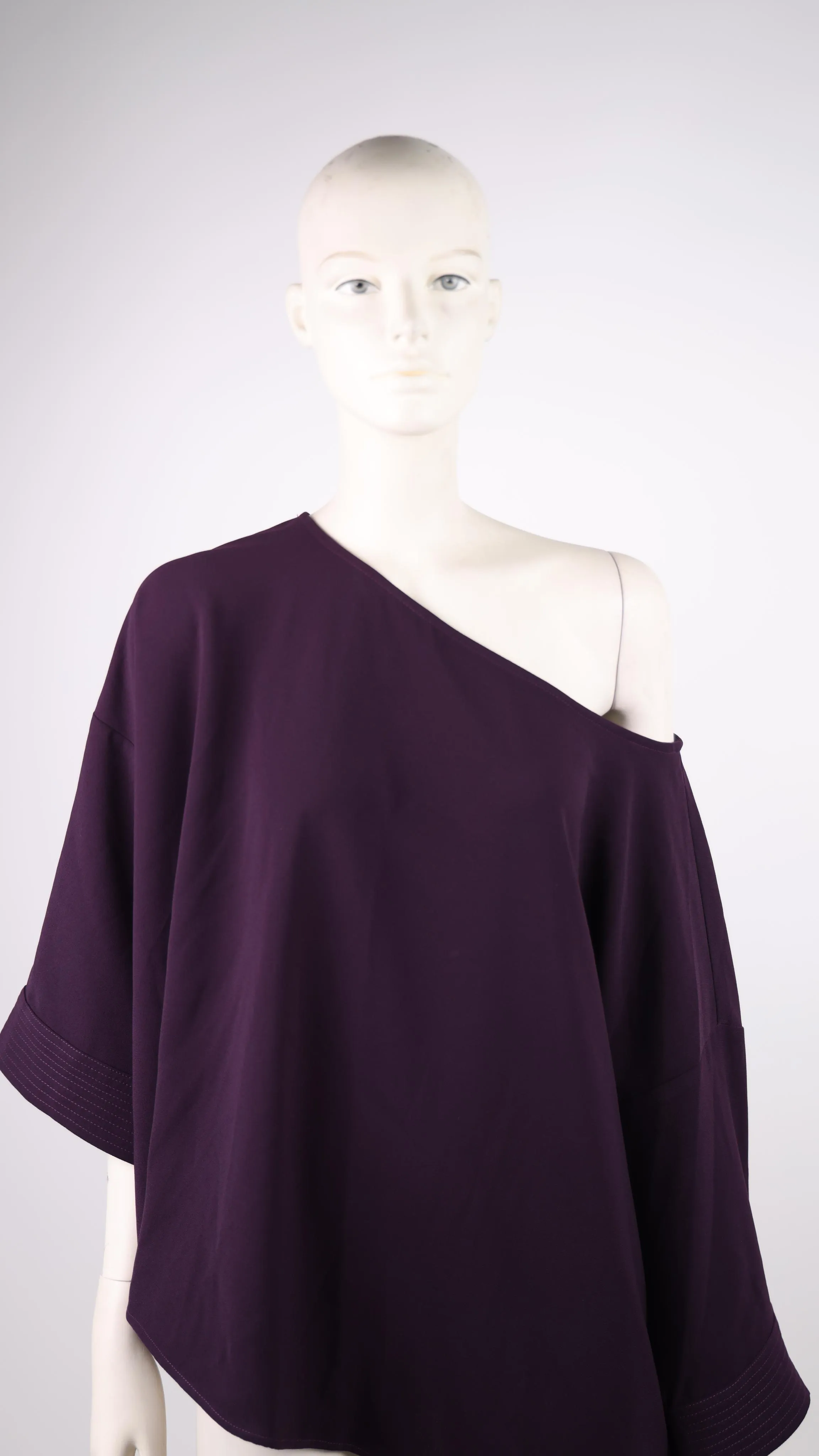 Access dark purple blouse with one sleeve down