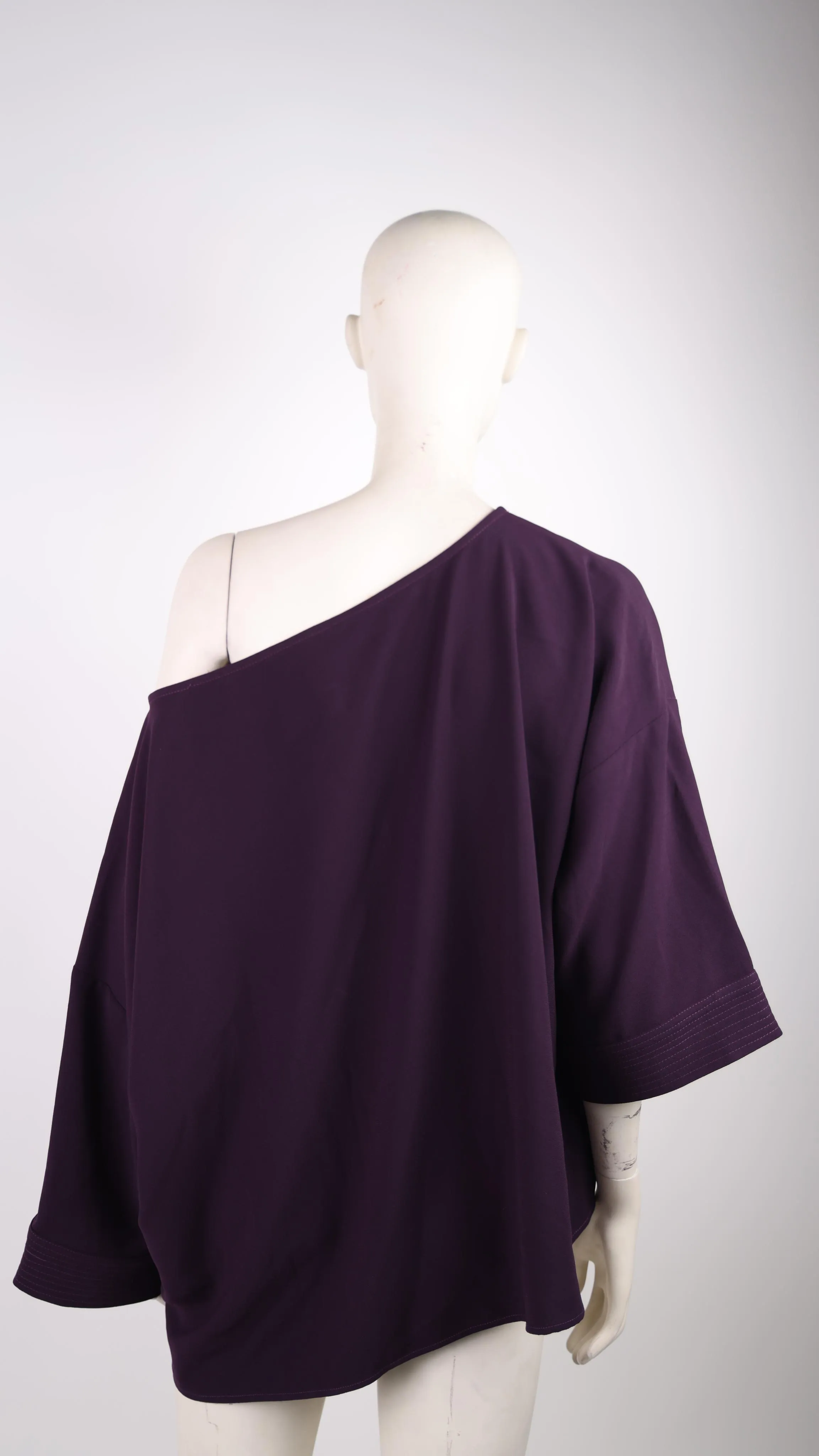 Access dark purple blouse with one sleeve down